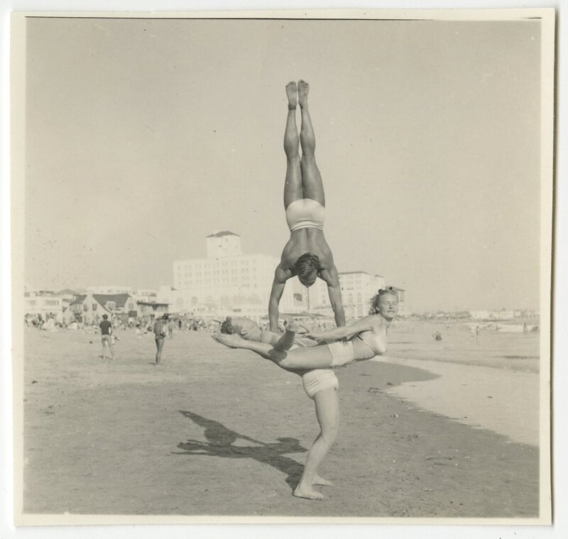Pudgy, Les and Bruce Conner doing acrobatics on the beach