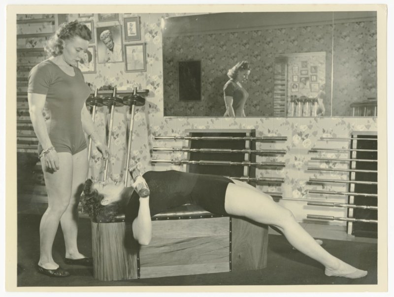 Pudgy assists Edith Roeder doing supine press