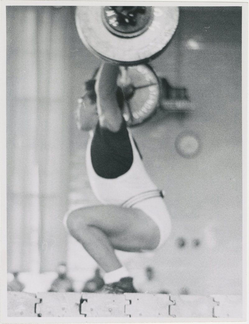 Photo of Tommy Kono performing an overhead lift