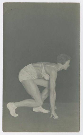 Ivy Russell crouching in starting block | Rogue Fitness